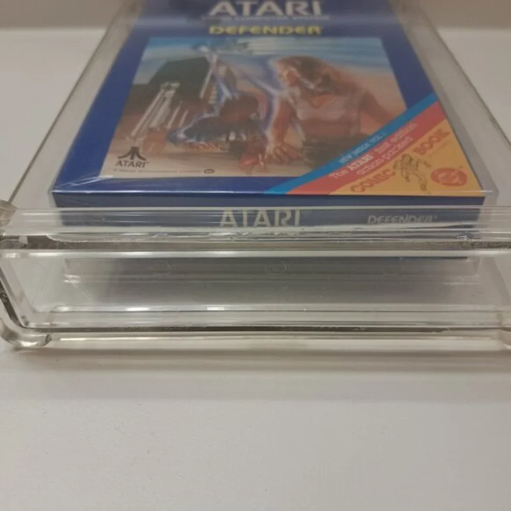 Atari 2600 DEFENDER - EARLY HANGTAB BLUE BOX! WATA GRADED 5.5! NEW & UNOPENED!